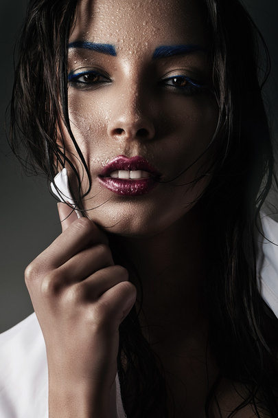 Woman with blue eyebrows - Фото, изображение