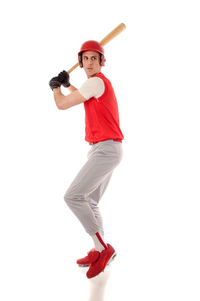 Male baseball player. Studio shot over white. - Photo, image