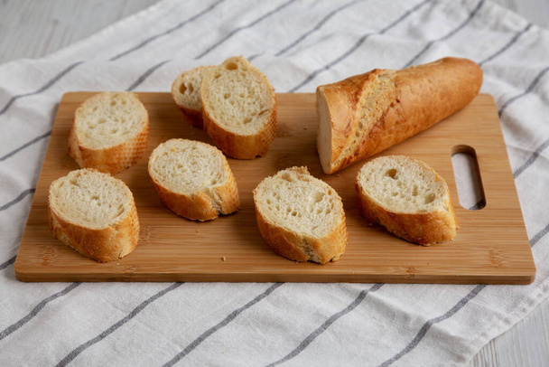 Homemade Sliced Bread on a bamboo board, low angle view.  - Photo, Image