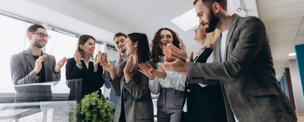 Multiracial group of business people clapping hands to congratulate their boss - Business company team, standing ovation after a successful meeting - Фото, зображення
