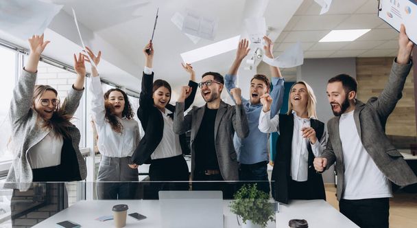 success and winning concept - happy business team celebrating victory in office - Fotoğraf, Görsel