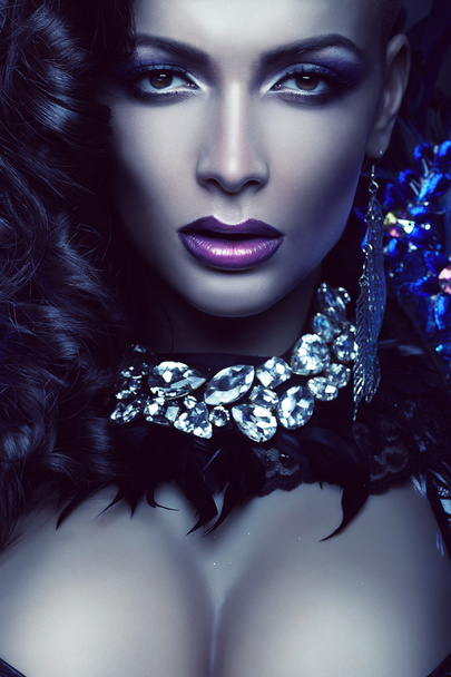 Woman in feather and diamonds - 写真・画像