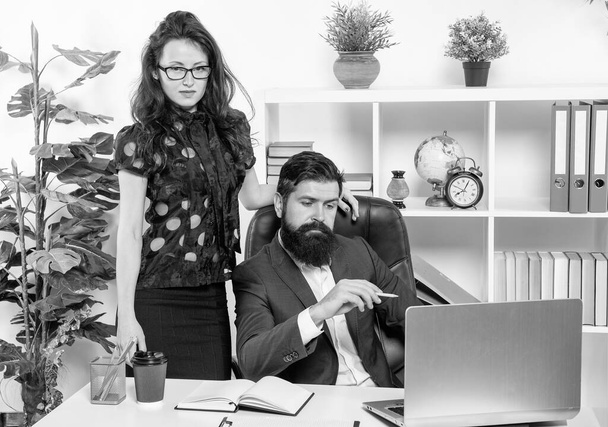 Engaged in serious work. Serious employees at work. Businesswoman stand over businessman. Professional couple in office. Business professionals. - Foto, immagini