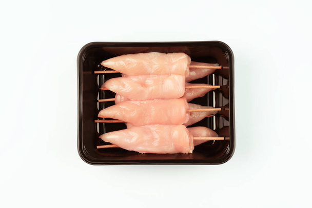 Chicken breast Fillets inner. Fresh, raw chicken inner in the package. Closeup of chicken meat. Procurement for designers. Chicken meat background. - Foto, immagini