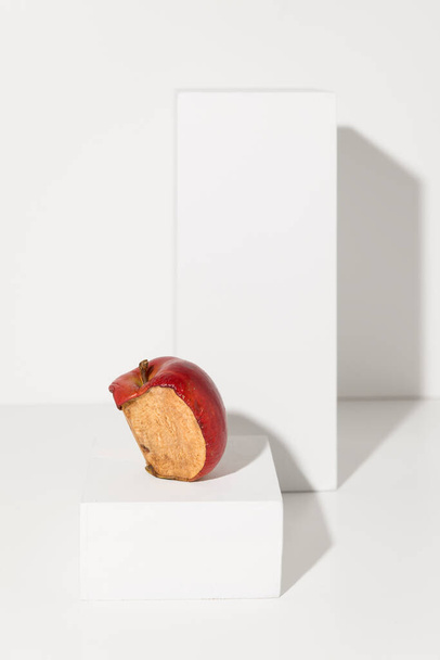 Half a rotten apple on white background - Foto, afbeelding
