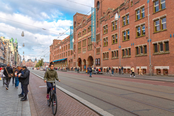 Amsterdam, NL - October 10, 2021: Exterior view of Beurs van Berlage building, designed by architect Hendrik Petrus Berlage and constructed between 1896 and 1903 on Damrak. - Photo, Image