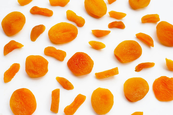 Dried apricots on white background. - Foto, afbeelding
