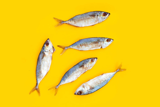 Salted fish on yellow background. - Foto, Bild
