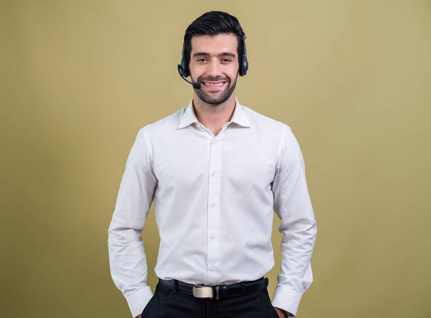 Male call center operator wearing headset and formal suit standing confidently on isolated background portrait. Professional smile and service minded for customer service and support. fervent - Zdjęcie, obraz
