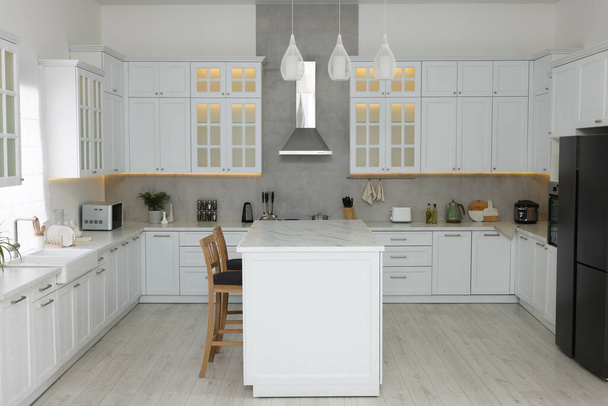 Stylish kitchen with modern furniture and different appliances. Interior design - Zdjęcie, obraz