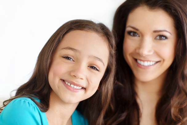 Proud of my little girl. Portrait of a mother and a daughter smiling at the camera - Fotoğraf, Görsel
