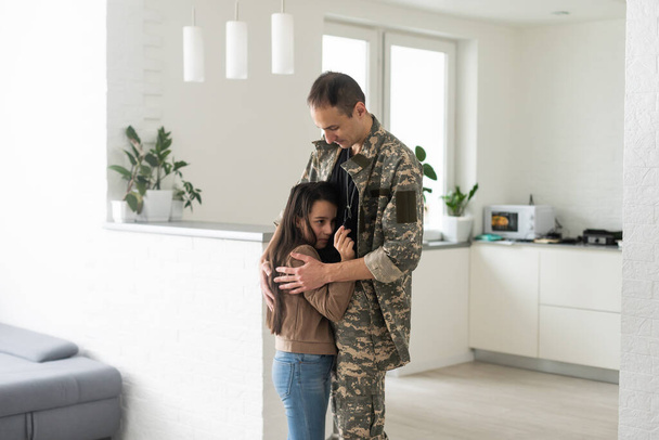 beautiful little daughter and military father at home. - Fotoğraf, Görsel