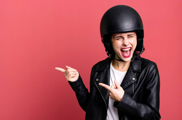young adult pretty woman. motorbike rider with leather jacket and helmet - Foto, Imagem