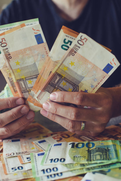 Euro banknotes in man's hands - Фото, изображение
