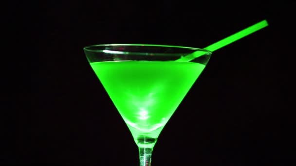 Green  cocktail. Wine  glass in rotation - Footage, Video