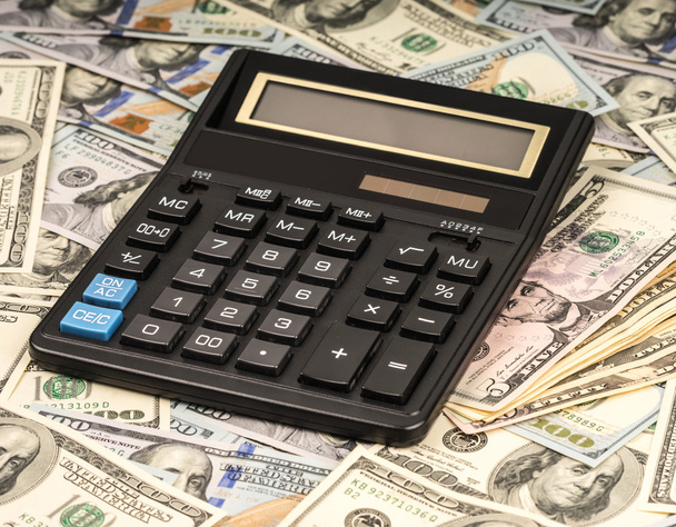 U. S. Dollars and calculator. Studio shot. - Photo, Image