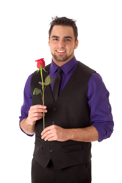 Well dressed young man with a single red rose. - Foto, Imagem