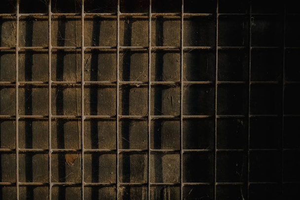 A beautiful metal grid wall background with shadows - Valokuva, kuva