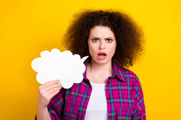 Photo of angry shocked lady wear checkered jacket holding talk cloud empty space isolated yellow color background. - Foto, Imagem