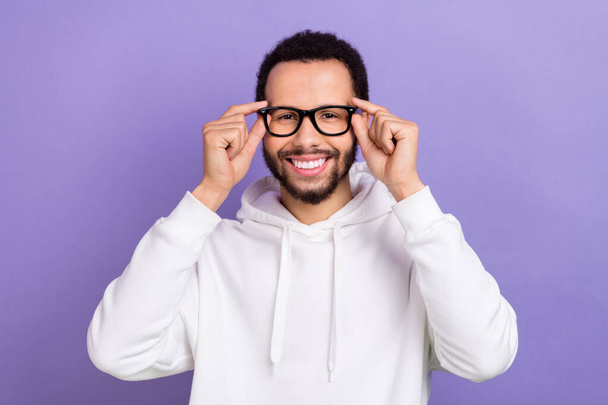 Photo of young toothy beaming smile hispanic guy wear white pullover new glasses spectacles best vision isolated on violet color background. - Фото, изображение