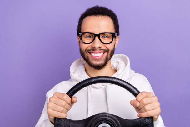 Closeup portrait of optimistic driver latin man hold steering wheel fast speed good mood nice vibe isolated on purple color background. - Photo, Image