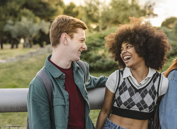 smiling multiracial young couple outdoors - Photo, Image