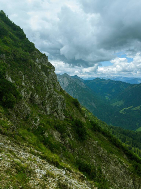 A beautiful landscape of green Alps on a cloudy day - 写真・画像