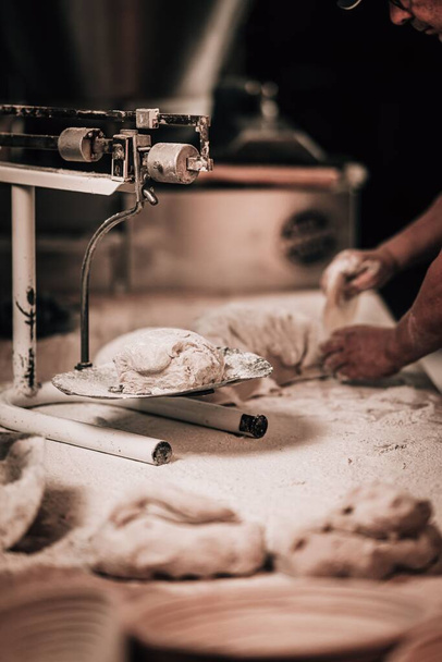 Pastry, cookies, croissants, baguette and bread are being made - Photo, image