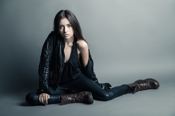 Fashion model wearing leather pants and jacket - Foto, Imagem