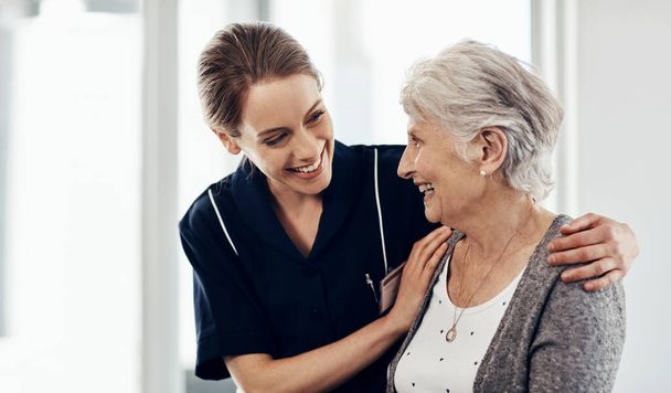 Her wellbeing is my first priority. a female nurse caring for a senior woman - 写真・画像