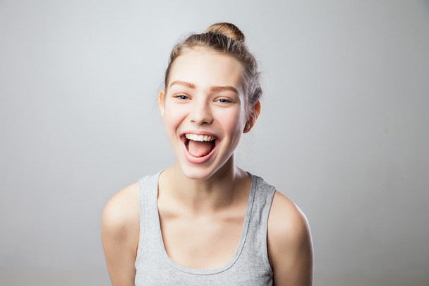 Portrait of young woman laughing and having fun. - Fotografie, Obrázek