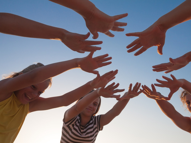 Group of friends  hands on sky background - Fotó, kép