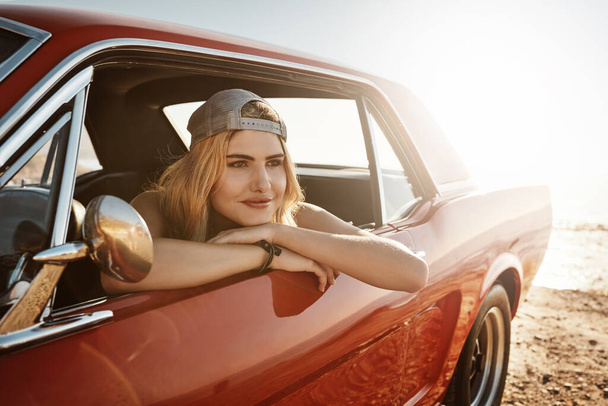 Reaching the destination is pretty great. an attractive young woman on a road trip - Foto, Imagem