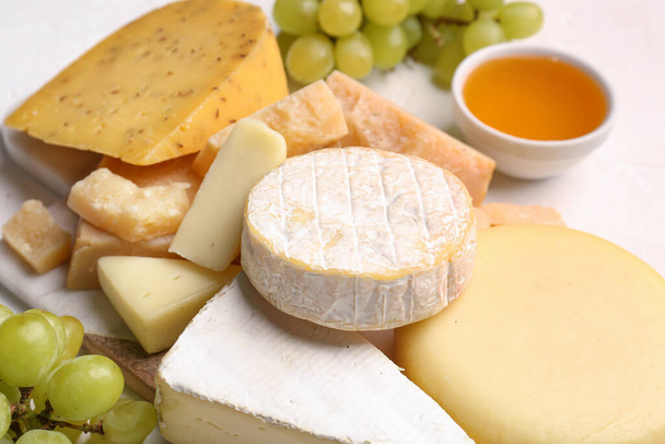 Different types of tasty cheese on table, closeup - Photo, Image