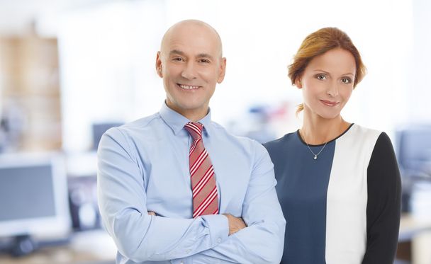 Businesswoman and businessman at office - Photo, Image