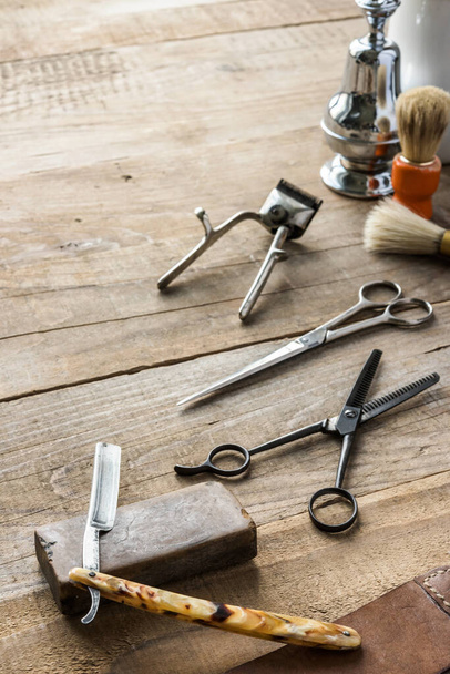 set of barber tools on wooden background - 写真・画像