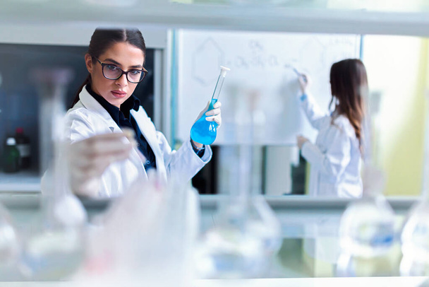 young female scientists working in laboratory  - Fotoğraf, Görsel