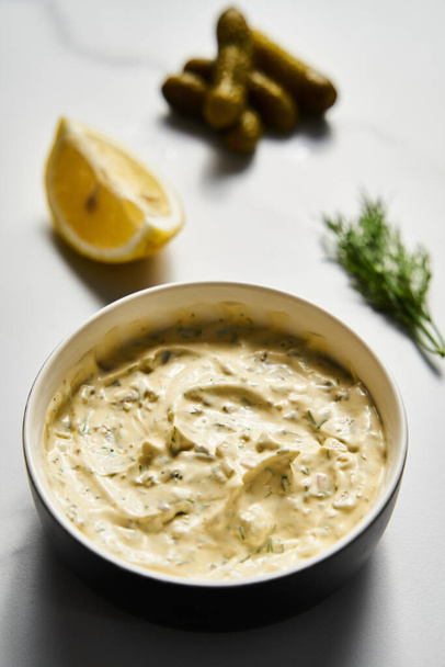 Classic Tartar Sauce dip in the bowl. Mayonnaise with dill and capers plus lemon, shallot onion. Worcester sauce and Dijon Mustard. High Quality Food Photo - Φωτογραφία, εικόνα