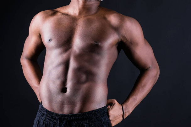 Muscular black african man with muscles abs abdominal, exercise determination and success - Fotó, kép