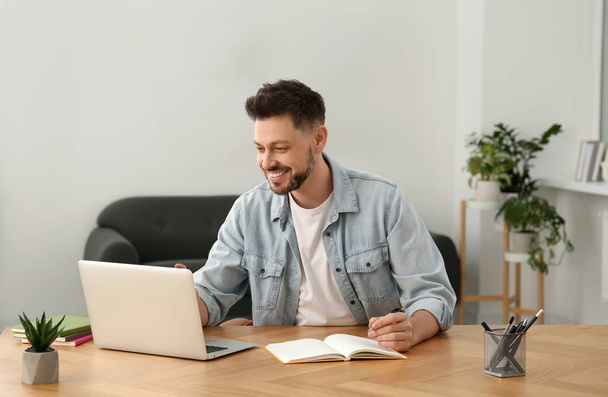 Man studying on laptop at home. Online translation course - Valokuva, kuva