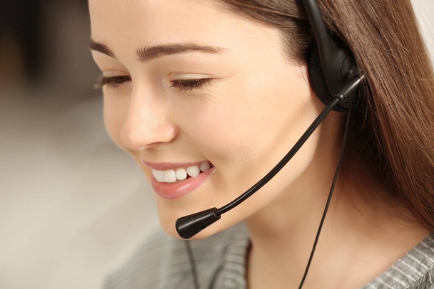 Hotline operator with headset working in office, closeup - Zdjęcie, obraz