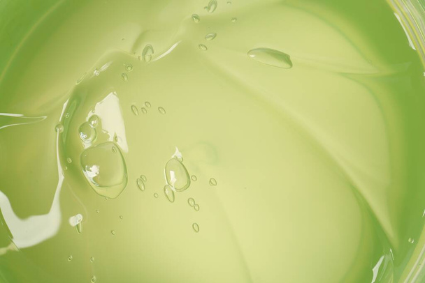 Texture of aloe gel as background, top view - Foto, immagini