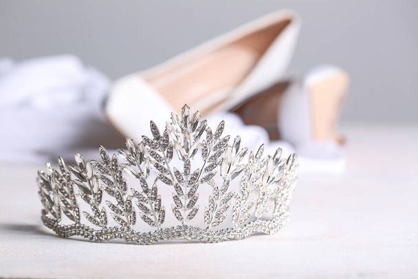 Beautiful tiara on white table, closeup. Prom concept - Foto, immagini