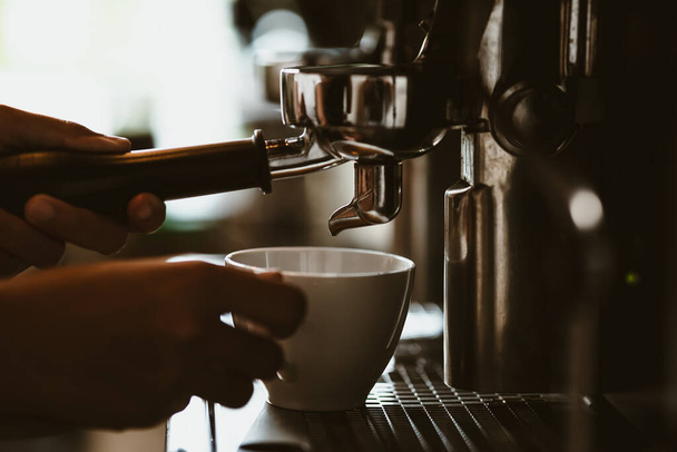 espresso machine in coffee shop counter offering freshly brewed coffee. coffee maker concept. - Фото, изображение