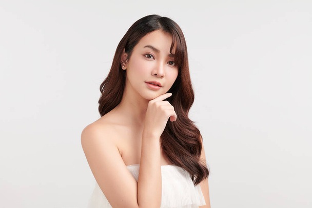 Beautiful young asian woman with clean fresh skin on white background, Face care, Facial treatment, Cosmetology, beauty and spa, Asian women portrait. - Photo, Image