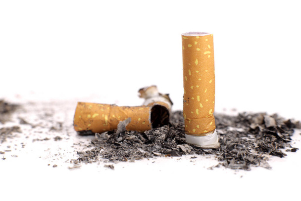 Cigarette butts with ashes on a white background - Photo, image