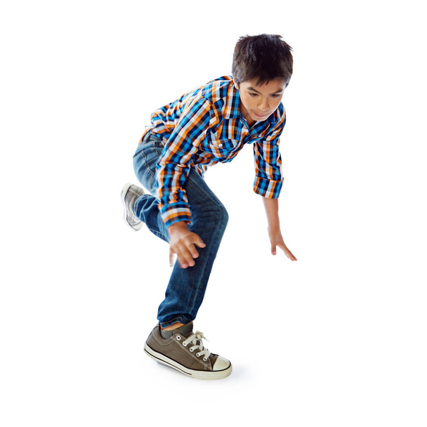 Kijk naar zijn bewegingen. Studio shot van een jonge jongen dansen tegen een witte achtergrond - Foto, afbeelding