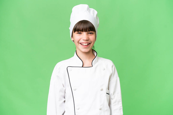 Yüzünde sürpriz bir ifade olan, izole edilmiş bir geçmişi olan beyaz bir aşçı kız. - Fotoğraf, Görsel