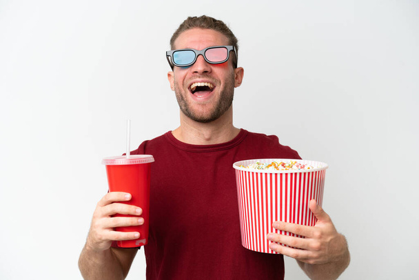 Young caucasian man holding popcorn and soda isolated on white background - Foto, Imagem
