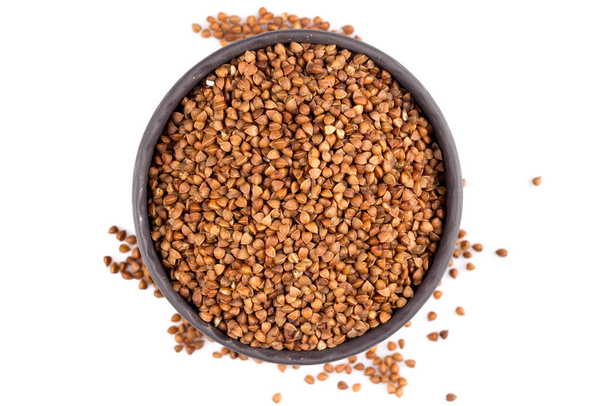 Buckwheat groats in a bowl, close up photo - Фото, изображение